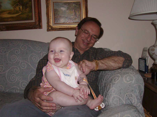 =Phil, Kaitlyn smiling on couch