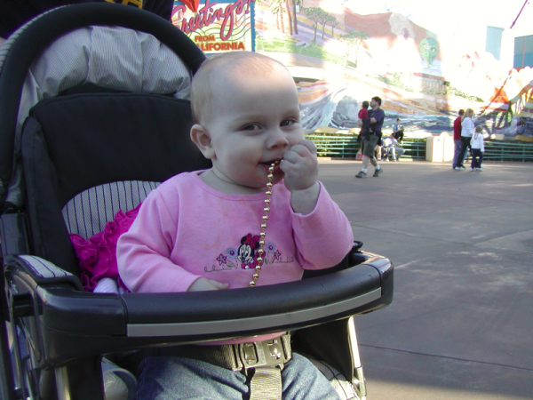 +stroller Kaitlyn beads in mouth smile